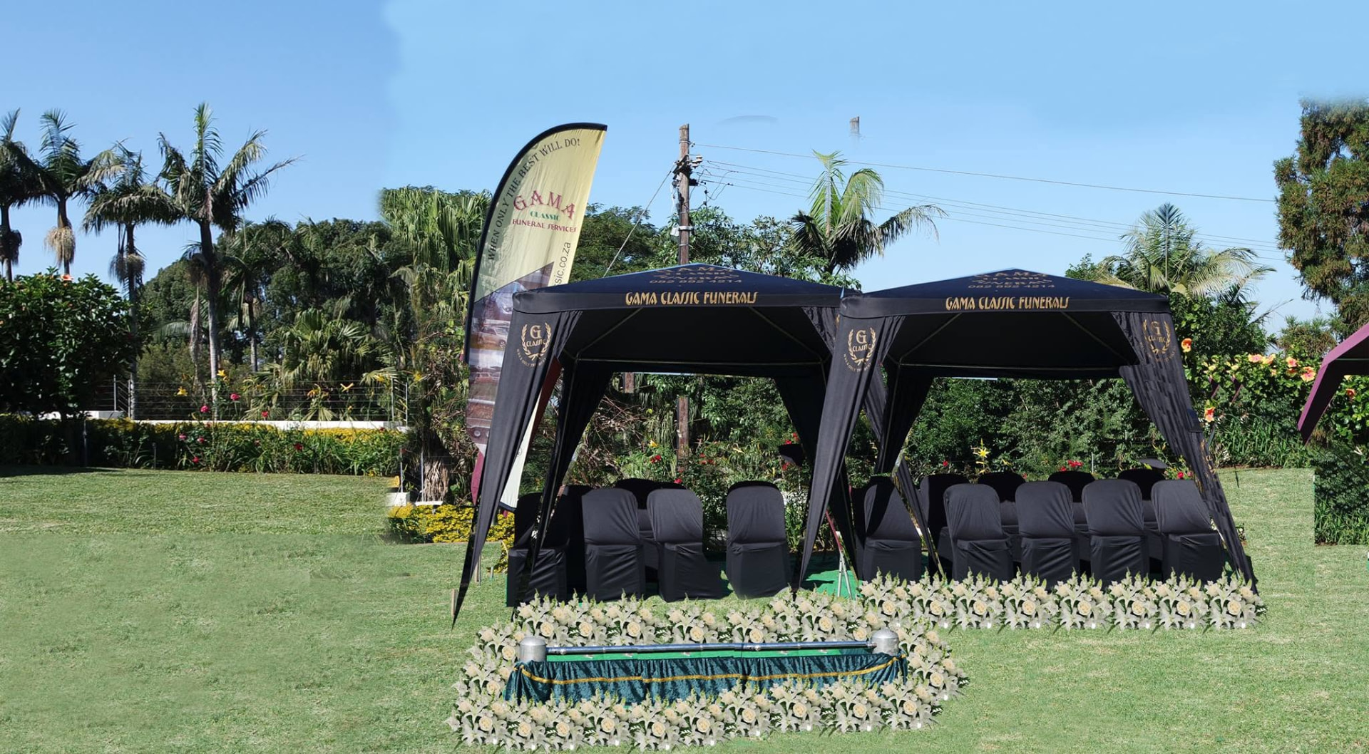 Gama Classic Funerals outdoor seating and white floral arrangements.